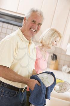 Royalty Free Photo of a Couple Doing Dishes