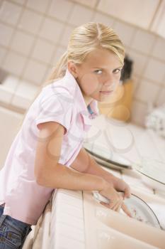 Royalty Free Photo of a Girl Doing Dishes
