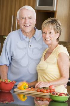 Royalty Free Photo of a Husband and Wife Preparing Vegetables