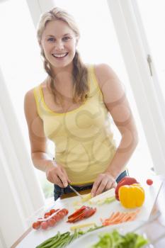 Royalty Free Photo of a Woman Preparing a Meal
