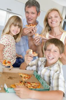 Royalty Free Photo of a Family With Pizza