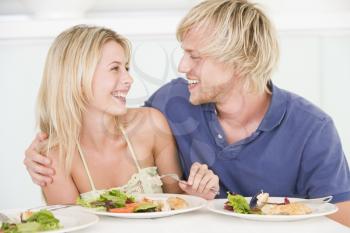 Royalty Free Photo of a Young Couple Having Dinenr