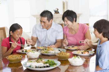 Royalty Free Photo of a Family Enjoying a Meal