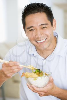 Royalty Free Photo of a Man Eating Chinese Food