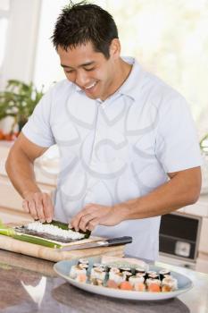 Royalty Free Photo of a Man Preparing Sushi