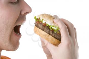 Royalty Free Photo of a Man About to Eat a Burger