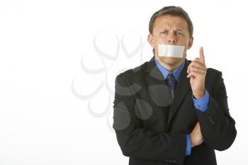 Royalty Free Photo of a Man With His Mouth Taped