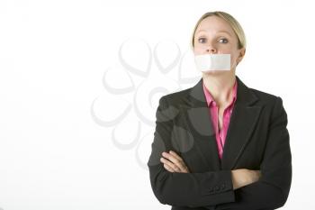 Royalty Free Photo of a Woman With Her Mouth Taped
