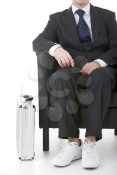 Royalty Free Photo of a Businessman Wearing Sneakers