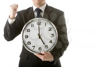 Royalty Free Photo of a Businessman Holding a Clock and Raising a Fist