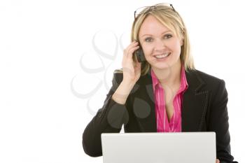 Royalty Free Photo of a Woman With a Laptop Talking on the Phone