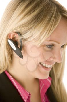 Royalty Free Photo of a Woman Wearing a Hands Free Device