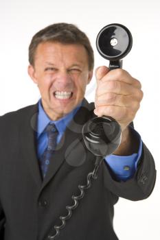 Royalty Free Photo of an Angry Man With a Telephone