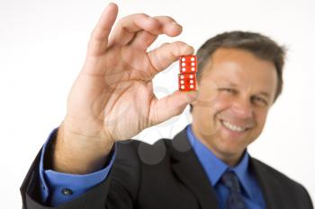 Royalty Free Photo of a Man Holding Two Dice