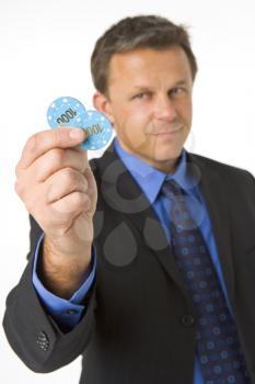 Royalty Free Photo of a Man Holding Poker Chips