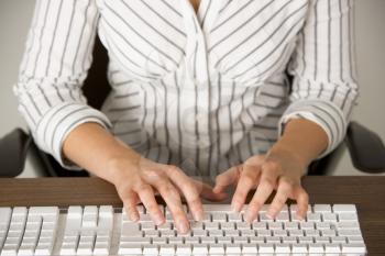 Royalty Free Photo of a Woman Typing