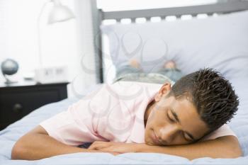 Royalty Free Photo of a Teenage Boy Sleeping