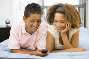 Royalty Free Photo of a Boy and Girl With a Cellphone