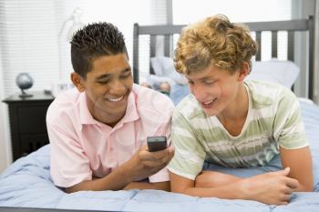 Royalty Free Photo of Two Boys With a Cellphone