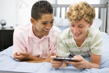 Royalty Free Photo of Teenagers Playing Video Games