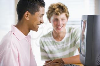 Royalty Free Photo of Two Boys Using a Computer
