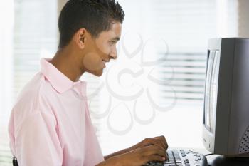 Royalty Free Photo of a Boy at the Computer
