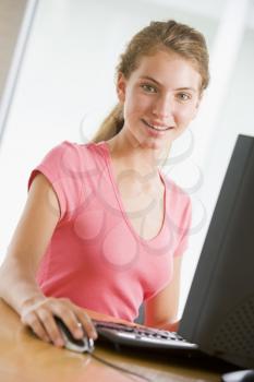 Royalty Free Photo of a Teenage Girl at a Computer
