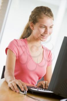 Royalty Free Photo of a Girl Using a Computer