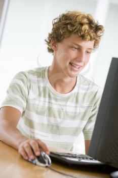Royalty Free Photo of a Boy at the Computer