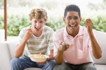 Royalty Free Photo of Teens Eating Chips