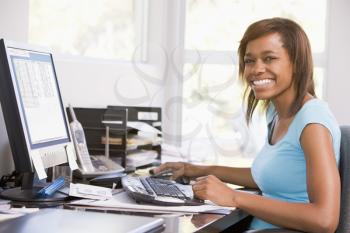Royalty Free Photo of a Girl Using a Computer
