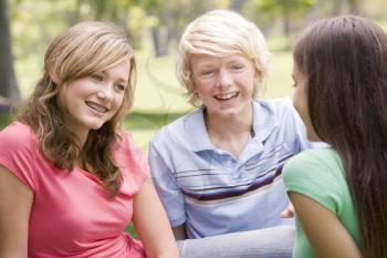 Royalty Free Photo of Three Teens Talking