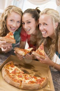 Royalty Free Photo of Girls Eating Pizza