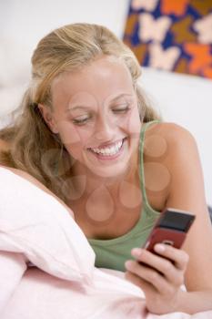 Royalty Free Photo of a Girl Using a Mobile Phone