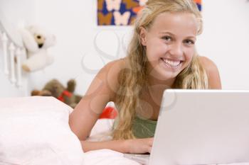 Royalty Free Photo of a Girl Using a Laptop