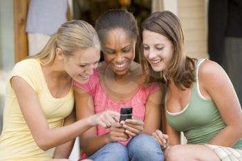 Royalty Free Photo of Girls With a Cellphone