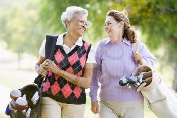 Royalty Free Photo of Female Friends Golfing