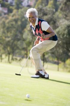 Royalty Free Photo of a Woman Playing Golf