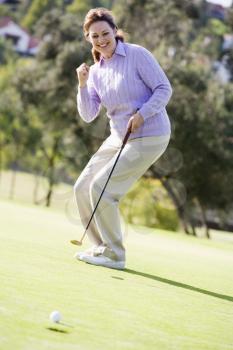 Royalty Free Photo of a Woman Playing Golf
