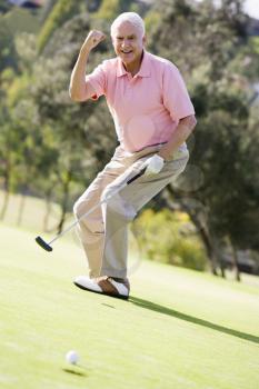 Royalty Free Photo of a Man Playing Golf