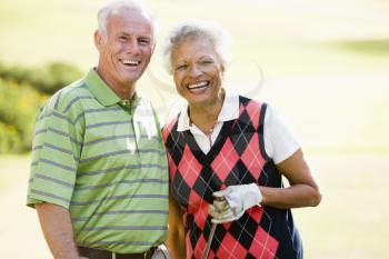 Royalty Free Photo of a Couple Golfing