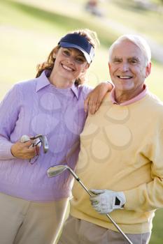 Royalty Free Photo of a Couple Golfing