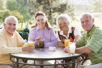 Royalty Free Photo of Friends Enjoying a Beverage at a Golf Course