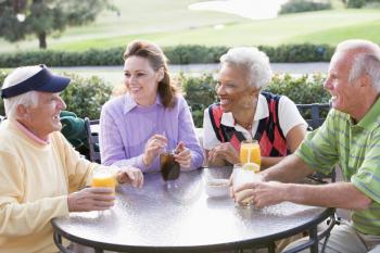 Royalty Free Photo of Friends Having a Drink at a Golf Course