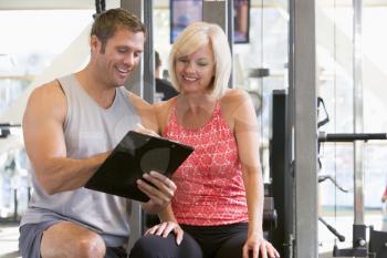 Royalty Free Photo of a Woman With a Personal Trainer