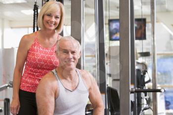 Royalty Free Photo of a Man and Woman at the Gym