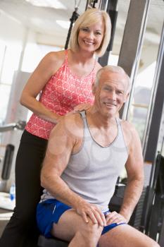 Royalty Free Photo of a Man and Woman at a Gym