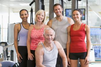 Royalty Free Photo of Men and Woman at a Gym