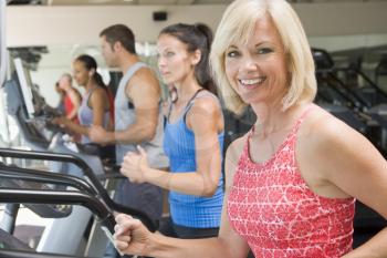 Royalty Free Photo of a Woman on a Treadmill
