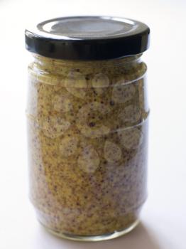 Royalty Free Photo of a Jar of Mustard Seed